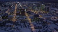 4K stock footage aerial video fly over icy shore of Cook Inlet and snowy Downtown Anchorage, Alaska, night Aerial Stock Footage | AK0001_1721