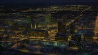 4K stock footage aerial video flying by snow covered Downtown Anchorage at night, Alaska Aerial Stock Footage | AK0001_1733