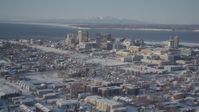 4K stock footage aerial video flying over snowy residential buildings toward Downtown Anchorage, Alaska Aerial Stock Footage | AK0001_2013