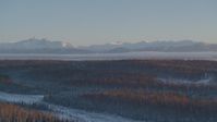 4K stock footage aerial video snow covered Chugach Mountains seen from Wasilla at sunset, Alaska Aerial Stock Footage | AK0001_2075