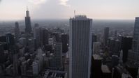 4.8K stock footage aerial video Orbiting Aon Center, with Downtown Chicago skyscrapers in the background, Illinois Aerial Stock Footage | AX0001_051