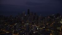 4.8K stock footage aerial video of Downtown Chicago cityscape at nighttime, Illinois Aerial Stock Footage | AX0003_137