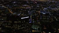5K stock footage aerial video top of Wells Fargo Center at night in Downtown Los Angeles, California Aerial Stock Footage | AX0004_057