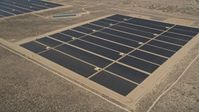 5K stock footage aerial video of solar panels at an energy array in the Mojave Desert, California Aerial Stock Footage | AX0005_112