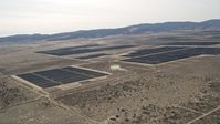5K stock footage aerial video of a large solar energy array in the Mojave Desert, California Aerial Stock Footage | AX0005_115