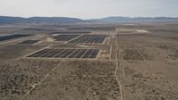 5K stock footage aerial video flyby Mojave Desert solar energy array in California Aerial Stock Footage | AX0005_117