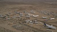 5K stock footage aerial video of airplanes and components at an aircraft boneyard, Mojave Air and Space Port, California Aerial Stock Footage | AX0006_086