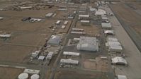5K stock footage aerial video orbit hangars and runways at the Mojave Air and Space Port in California Aerial Stock Footage | AX0006_091