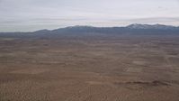 5K stock footage aerial video of VFX Plate of desert with mountains background, Mojave Desert, California Aerial Stock Footage | AX0006_119