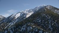 5K stock footage aerial video of a snowy mountain peak in the San Gabriel Mountains, California Aerial Stock Footage | AX0009_057