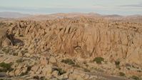 5K stock footage aerial video fly over rock formations, Joshua Tree National Park, California Aerial Stock Footage | AX0011_039E