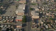 5K stock footage aerial video of following a city street past apartment buildings, South Central Los Angeles Aerial Stock Footage | AX0017_036