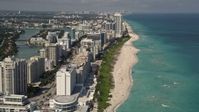 5K stock footage aerial video fly over beachfront condominiums with ocean views in Miami Beach, Florida Aerial Stock Footage | AX0020_058