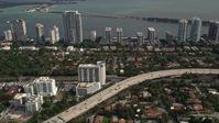 5K stock footage aerial video of Interstate 95 near waterfront condos in Downtown Miami, Florida Aerial Stock Footage | AX0021_084