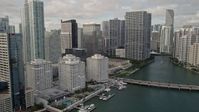 5K stock footage aerial video flyby waterfront skyscrapers to reveal Brickell Key Bridge in Downtown Miami, Florida Aerial Stock Footage | AX0021_120E