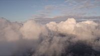 5K stock footage aerial video pan across formation of clouds at sunset over Miami, Florida Aerial Stock Footage | AX0022_010