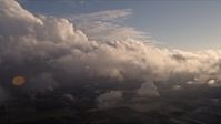 5K stock footage aerial video approach the side of a cloud formation at sunset over Miami, Florida Aerial Stock Footage | AX0022_018