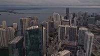 5K stock footage aerial video approach skyscrapers on the bay shore in Downtown Miami at sunset, Florida Aerial Stock Footage | AX0022_035E