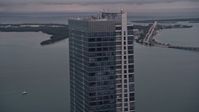 5K stock footage aerial video flyby the top of the Four Seasons Hotel tower at sunset in Downtown Miami, Florida Aerial Stock Footage | AX0022_069E