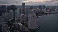 5K stock footage aerial video of Brickell Key skyscrapers at sunset, reveal the river in Downtown Miami, Florida Aerial Stock Footage | AX0022_081E