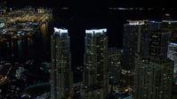 5K stock footage aerial video orbit Vizcayne Towers at night in Downtown Miami, Florida Aerial Stock Footage | AX0023_023E