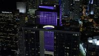5K stock footage aerial video of approaching 500 Brickell and Brickell World Plaza at night in Downtown Miami, Florida Aerial Stock Footage | AX0023_028E