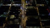5K stock footage aerial video fly over cars on Collins Avenue at night through South Beach, Florida Aerial Stock Footage | AX0023_114E