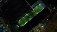 5K stock footage aerial video bird's eye view of soccer fields at night in Downtown Miami, Florida Aerial Stock Footage | AX0023_169