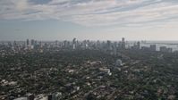 5K stock footage aerial video fly over neighborhoods, reveal Downtown Miami skyline, Coconut Grove, Florida Aerial Stock Footage | AX0024_025E
