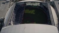5K stock footage aerial video of approaching Marlins Park, tilt to bird's eye of stadium in Miami, Florida Aerial Stock Footage | AX0024_034E