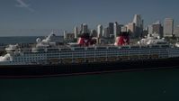 5K stock footage aerial video of approaching and flying by Disney Cruise Ship at Port of Miami, Miami, Florida Aerial Stock Footage | AX0024_066E