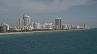 5K stock footage aerial video of flying by hotels along the shore, Miami Beach, Florida Aerial Stock Footage | AX0024_082E