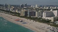 5K stock footage aerial video of flying along the shore of South Beach and passing hotels, Miami Beach, Florida Aerial Stock Footage | AX0024_093