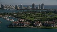 5K stock footage aerial video of flying by Fisher Island Golf Course, Fisher Island, Florida Aerial Stock Footage | AX0024_100