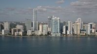 5K stock footage aerial video of flying by Downtown Miami skyline, seen from Biscayne Bay, Florida Aerial Stock Footage | AX0024_119
