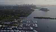 5K stock footage aerial video fly over marinas, Downtown Miami skyline, Coconut Grove, Florida, sunrise Aerial Stock Footage | AX0029_007