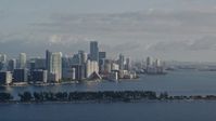 5K stock footage aerial video of flying by Downtown Miami skyline, Florida, sunrise Aerial Stock Footage | AX0029_009E
