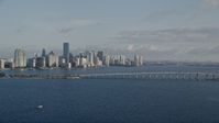 5K stock footage aerial video of downtown skyline, Rickenbacker Causeway bridge, Miami, Florida, sunrise Aerial Stock Footage | AX0029_011