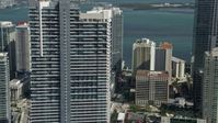 5K stock footage aerial video of flying by Infinity at Brickell, revealing Espirito Santo Plaza, Downtown Miami, Florida Aerial Stock Footage | AX0031_032