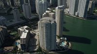 5K stock footage aerial video of flying by skyscrapers on the shore of Brickell Key, Downtown Miami, Florida Aerial Stock Footage | AX0031_037