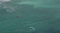 5K stock footage aerial video track a kite surfer near the coast, Hollywood, Florida Aerial Stock Footage | AX0031_097