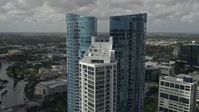 5K stock footage aerial video of flying by the top of Las Olas River House, Downtown Fort Lauderdale, Florida Aerial Stock Footage | AX0031_116