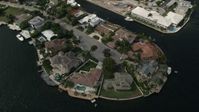5K stock footage aerial video of approaching mansions by canals, tilt down, Fort Lauderdale, Florida Aerial Stock Footage | AX0031_139