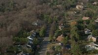 5K stock footage aerial video flyby a suburban homes in Syosset, Long Island, New York, winter Aerial Stock Footage | AX0065_0015