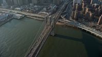 5K stock footage aerial video of heavy traffic leaving Lower Manhattan on the Brooklyn Bridge, New York City, winter Aerial Stock Footage | AX0065_0105