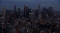7.6K stock footage aerial video flying by giant skyscrapers in Downtown Los Angeles at sunrise, California Aerial Stock Footage | AX0156_059