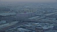 7.6K stock footage aerial video of office building and heavy traffic on I-10 in Downtown Los Angeles, California at sunrise Aerial Stock Footage | AX0156_104