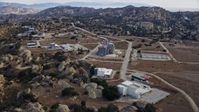 7.6K stock footage aerial video orbiting buildings at the Rocketdyne aerospace testing facility in Brandeis, California Aerial Stock Footage | AX0157_049