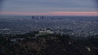 7.6K stock footage aerial video of Griffith Observatory revealing downtown Los Angeles and city sprawl, twilight, California Aerial Stock Footage | AX0158_013