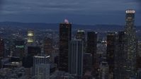 7.6K stock footage aerial video circling a group of skyscrapers at twilight in Downtown Los Angeles, California Aerial Stock Footage | AX0158_048